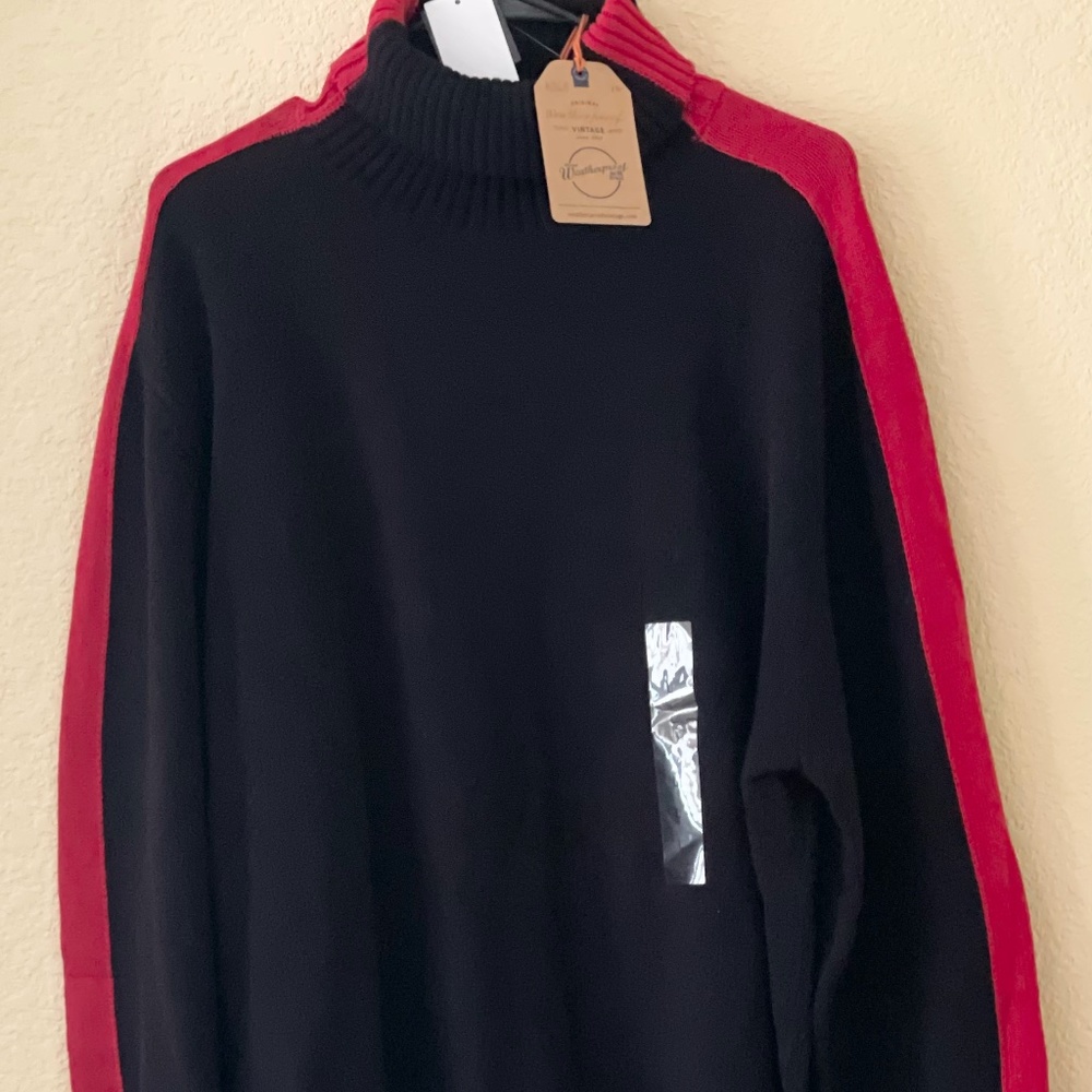 Black Sweater with red strips on the sleeve